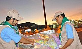 Scouts serve elderly pilgrims at Halat Ammar crossing in Tabuk